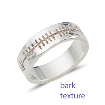 sterling silver flat band with a polished bark finish and inscribed with celtic Ogham