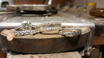 selection of white gold diamond rings after eing cleaned and rhodium plated