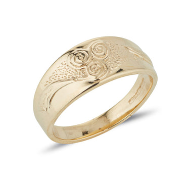 yellow gold celtic design ring with new grange spiral embossed on a tapered band