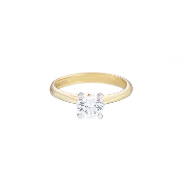 18ct yellow gold diamond solitaire ring with a round brilliant cut diamond set in white gold