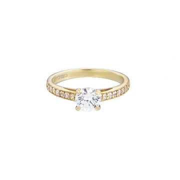 18ct yellow gold diamond solitaire ring with a round brilliant cut diamond set in white gold and diamond set shoulders