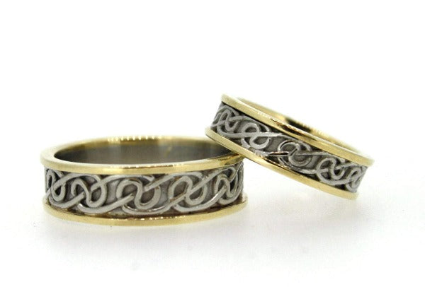 2 tone white gold inside with yellow gold rimms celtic design wedding rings