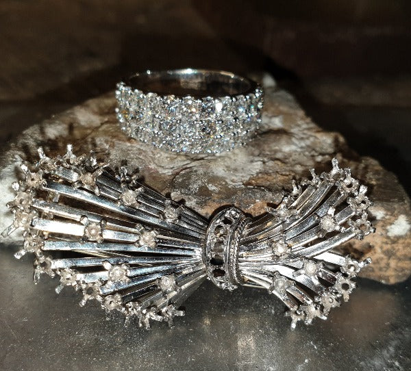 this shows a remodel job, it was a brooch which was diamond set,  now it is a stunning 3 row cocktail diamond ring