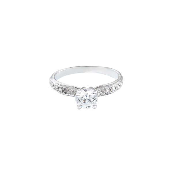 18ct white gold diamond solitaire engagement ring with round stone set in 4 claws and pave set shoulders