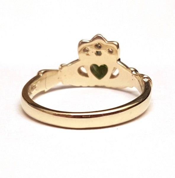 9ct yellow gold ladies birthstone claddagh ring with heart shaped stone in the centre and small round stones in the crown showing the back of the ring to show its solid