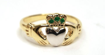 yellow gold ladies claddagh ring with white gold heart and 3 rubies in the crown 