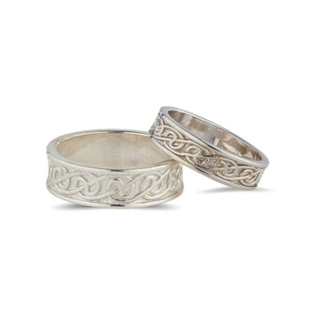 sterling silver celtic lovers knot matching his and hers wedding ring sets, the celtic design is in the middle of 2 raised edges