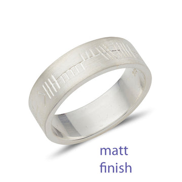 flat wedding ring with a matt finish and with Ogham personalised celtic script