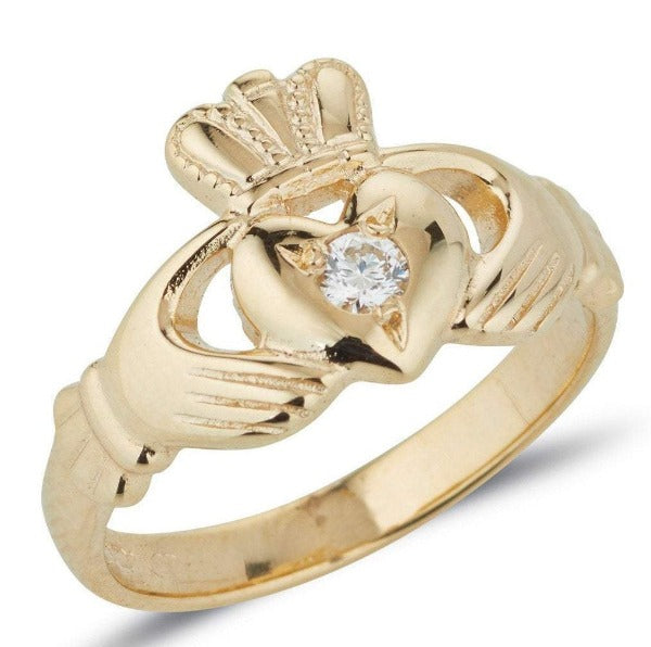 gold ladies claddagh ring with small diamond set into the middle of the heart