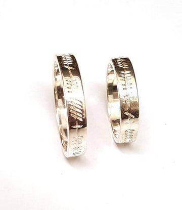 matching his and hers celtic ogham inscription wedding bands