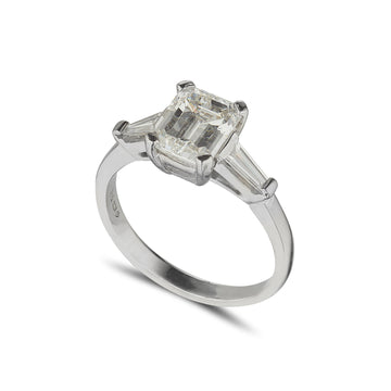 platinum diamond solitaire ring with 2 tappered baguette diamonds at the side