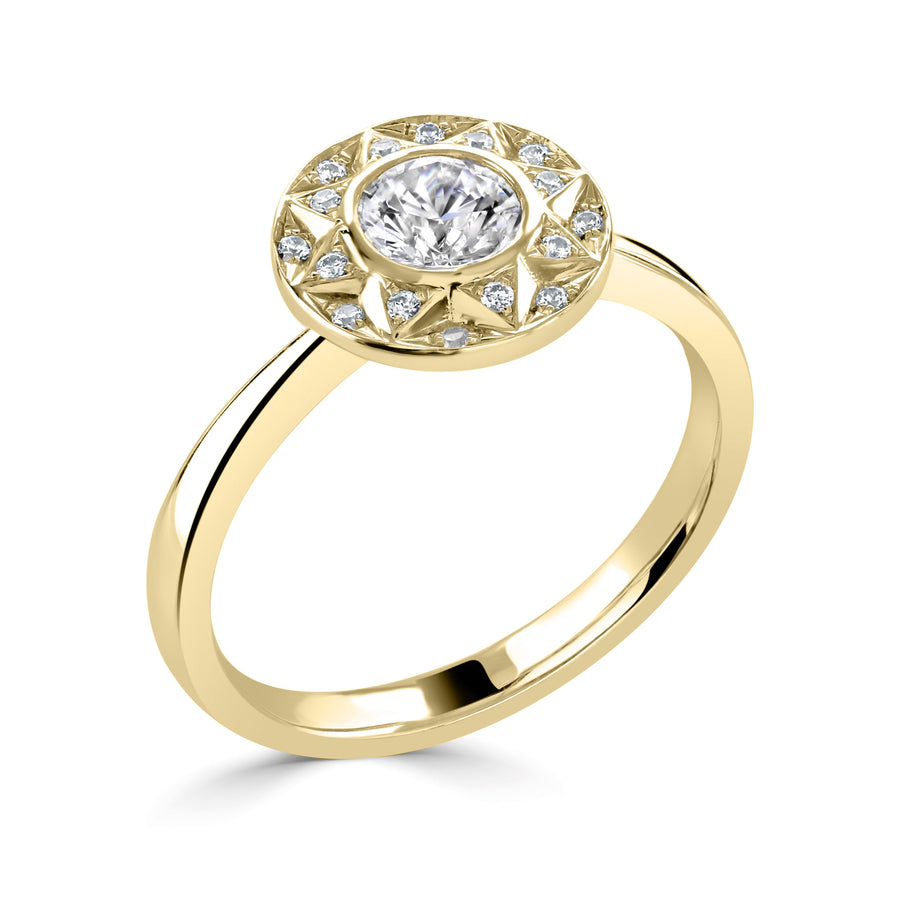 vintage style bezel set halo ring in yellow gold