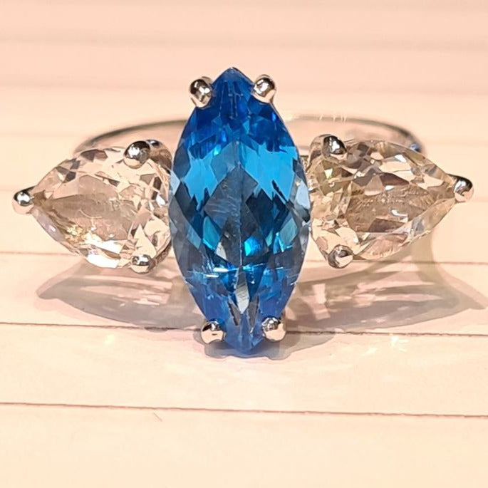 3 stone ring with a marquise blue tpaz and 2 pear shape aqua marine gemstones  ring 