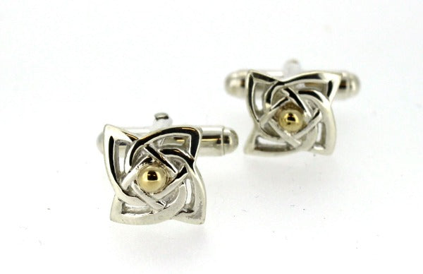 sterling silver celtic design cuff links with a curvey square shape and yellow gold detail in the centre,  the cufflink has a torpedo fitting
