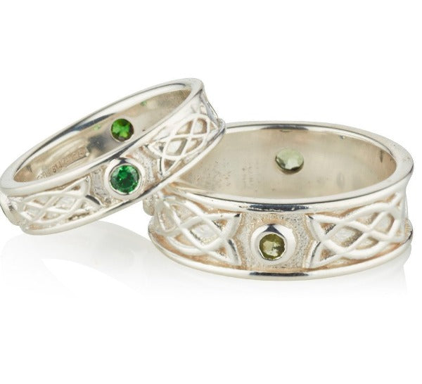 Sterling Silver celtic design matching his and hers rings, they are set with 3 green cubic zirconias in each ring, the 3 stones are rubover or bezel set at north east and west points of the ring, as shown on a ladies and gents hands