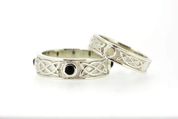 Sterling Silver celtic design matching his and hers rings, they are set with 3 onyx stones in the gents and 3 mother of pearls, the 3 stones are rubover or bezel set at north east and west points of the ring
