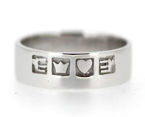 sterling silver claddagh band is 6mm in thickness with a flat profile. The symbols are split across the ring. The hands symbol for friendship, the heart for love and the crown for loyalty, the ring is oxidised behind the symbols