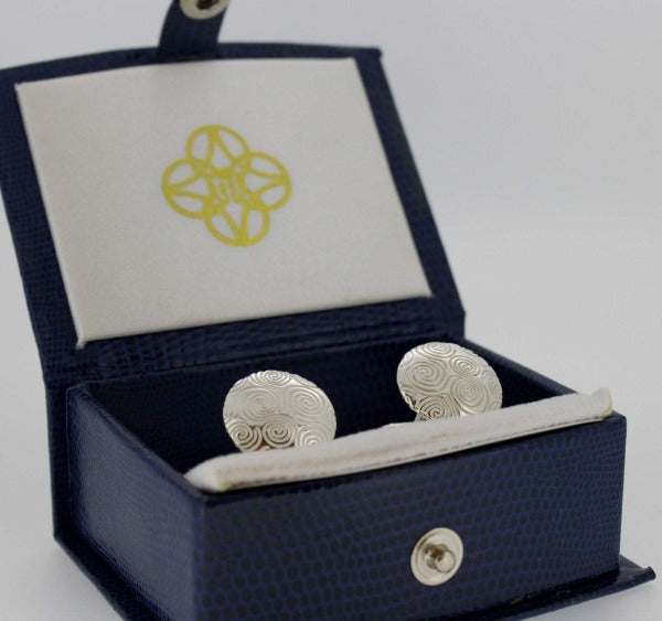 sterling silver newgrange spiral cufflinks, these are round in shape with lots of spirals in a box