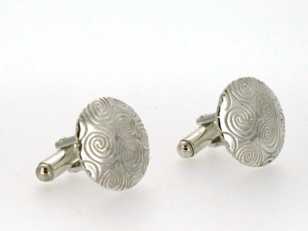 sterling silver newgrange spiral cufflinks, these are round in shape with lots of spirals