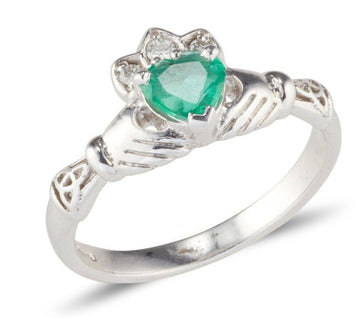 white gold ladies claddagh ring with a heart shaped emerald and diamond set crown