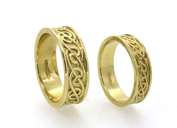 9ct yellow gold celtic lovers knot matching his and hers wedding ring sets, the celtic design is in the middle of 2 raised edges