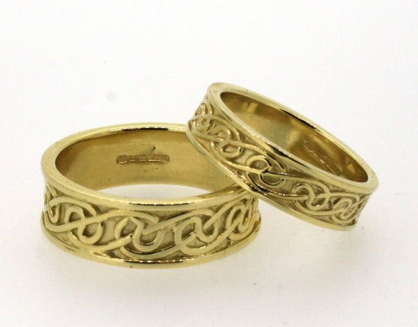 9ct yellow gold celtic lovers knot matching his and hers wedding ring sets, the celtic design is in the middle of 2 raised edges